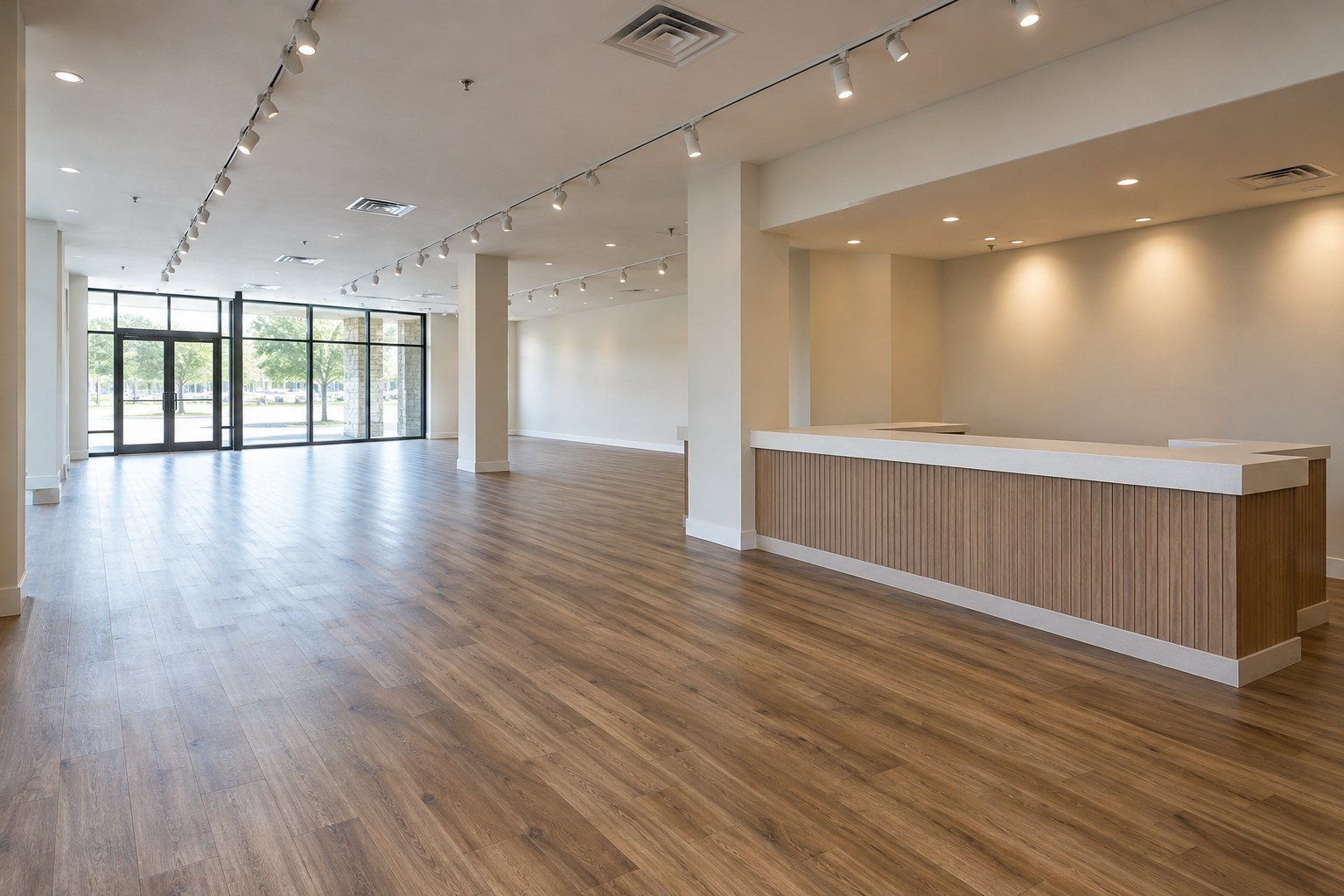 Empty retail build-out design concept with installed lighting and a built-in counter